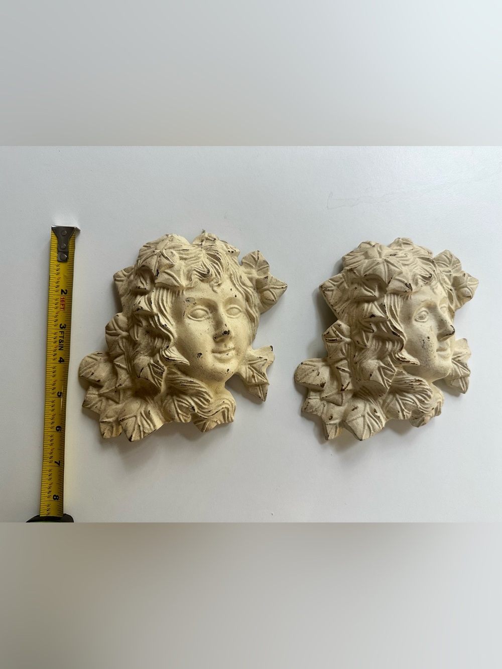 Vintage cast iron women faces wall plaques